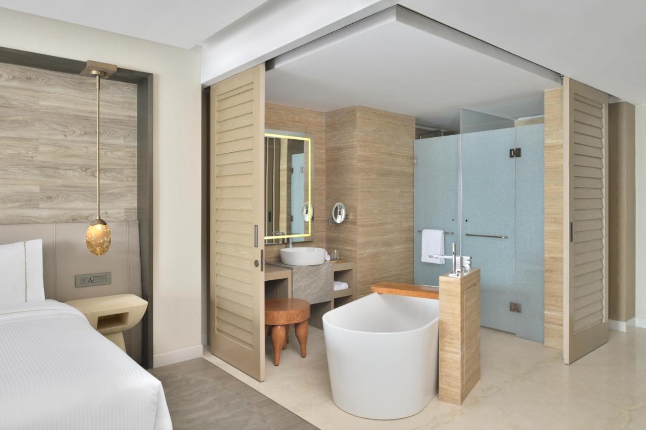 Deluxe King Room Balcony Skyline View | INR 1000 wellness credit per non-cumulative redeemable against Spa therapy or at Hakuna Matata the gaming zone