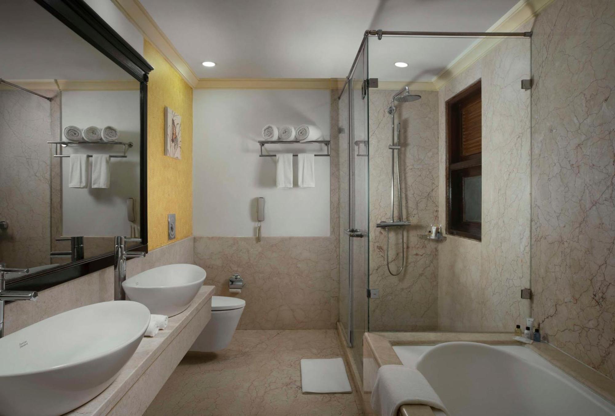 Radisson Suite Balcony Bathtub Living room & Garden view of Food & Beverages SPA 1 Goan Bottle INR 500 Hotel Credit spend of INR 5000 Early Check upto 2 hours subject