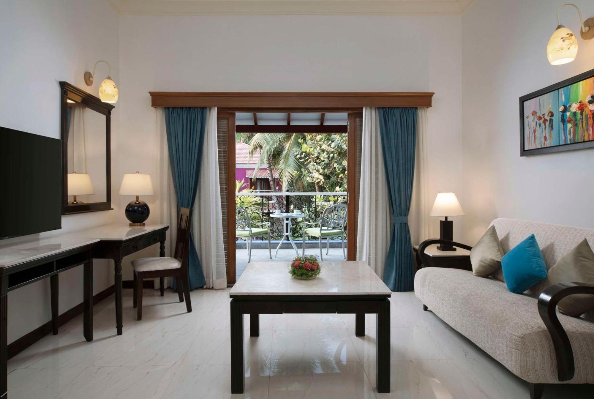 Radisson Suite Balcony Bathtub Living room & Garden view of Food & Beverages SPA 1 Goan Bottle INR 500 Hotel Credit spend of INR 5000 Early Check upto 2 hours subject