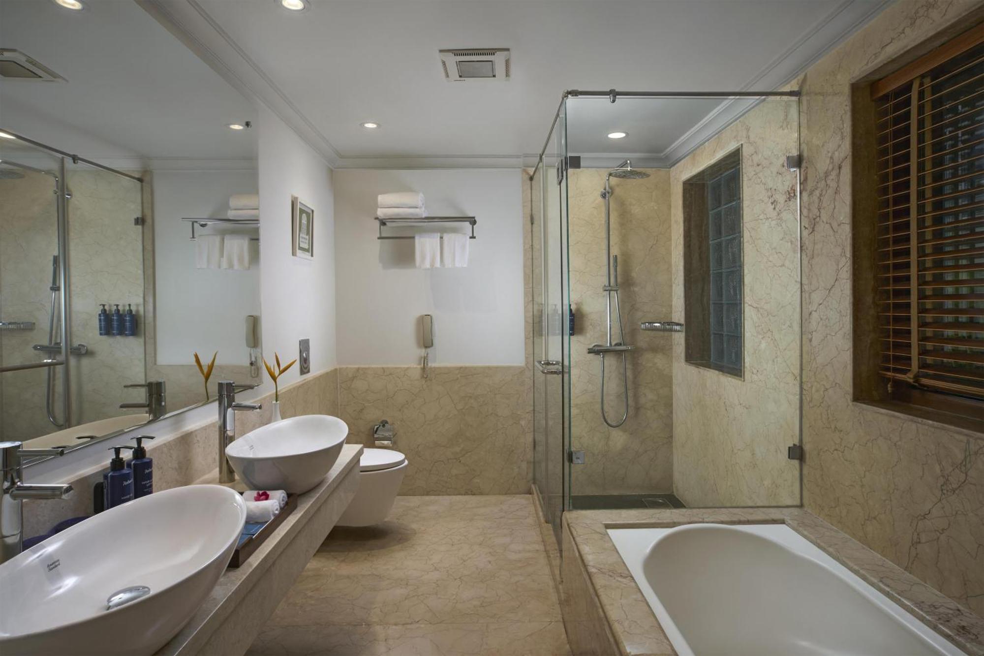 Radisson Suite Balcony Bathtub Living room & Garden view of Food & Beverages SPA 1 Goan Bottle INR 500 Hotel Credit spend of INR 5000 Early Check upto 2 hours subject