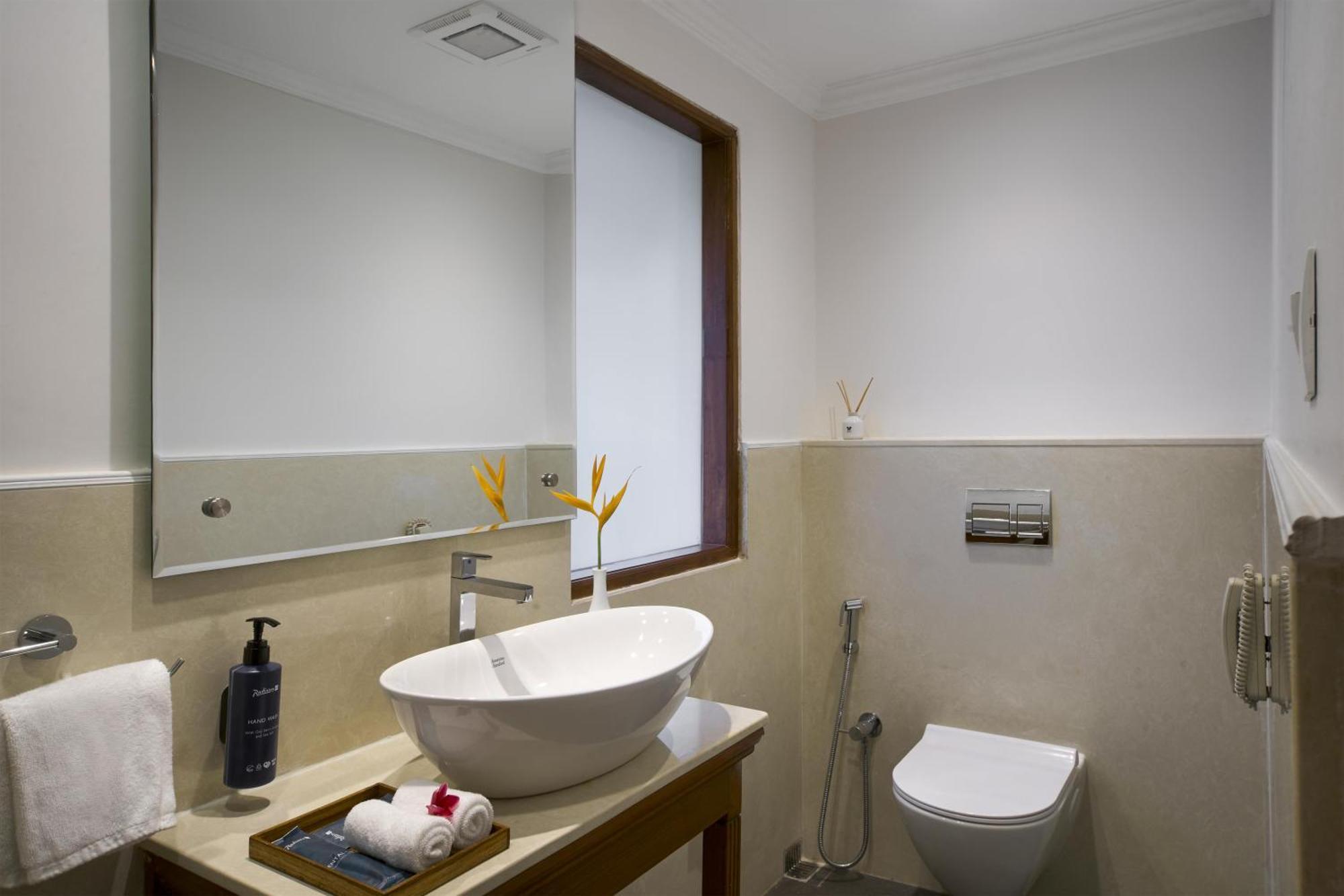 Radisson Suite Balcony Bathtub Living room & Garden view of Food & Beverages SPA 1 Goan Bottle INR 500 Hotel Credit spend of INR 5000 Early Check upto 2 hours subject