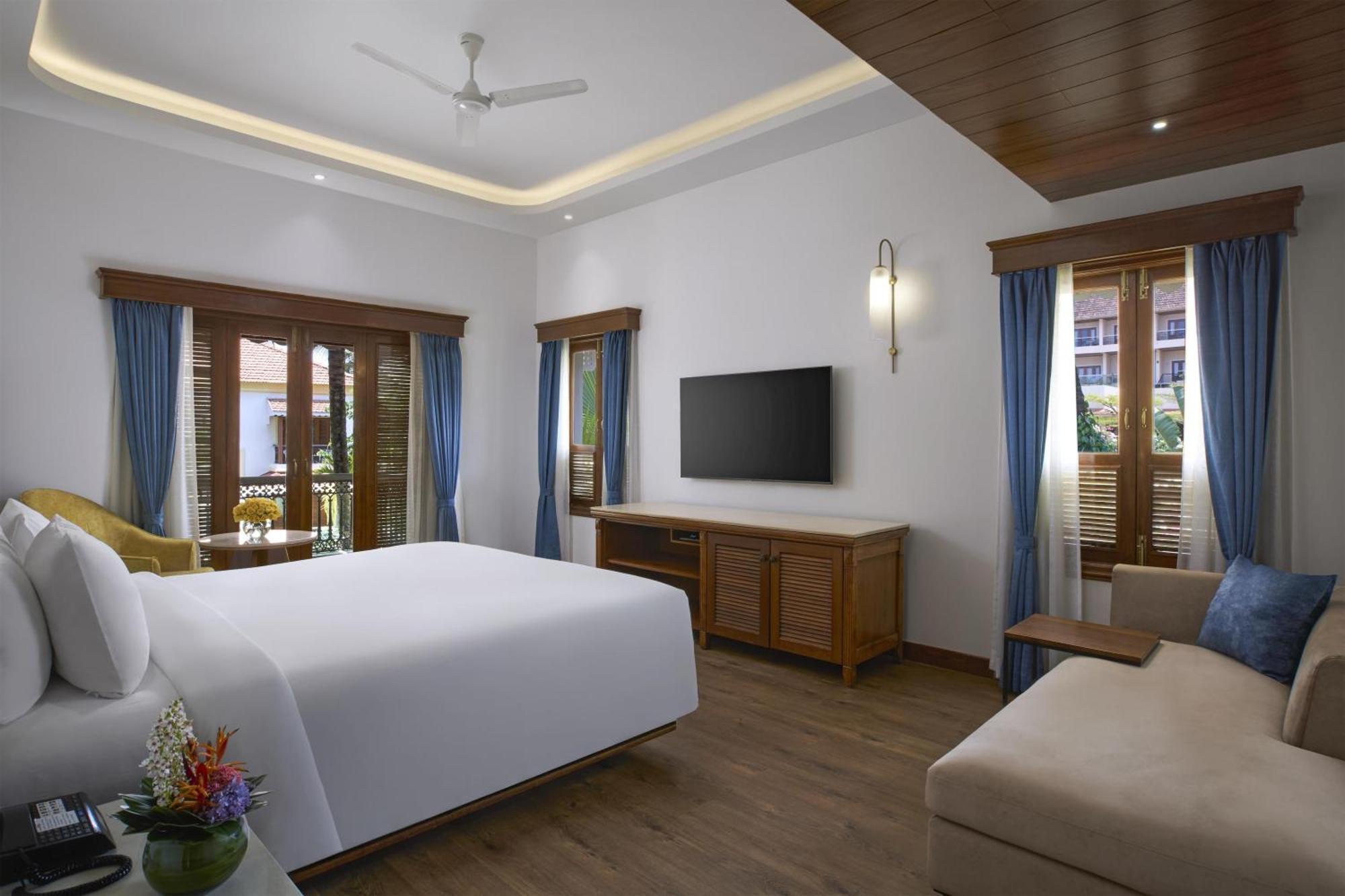Radisson Suite Balcony Bathtub Living room & Garden view of Food & Beverages SPA 1 Goan Bottle INR 500 Hotel Credit spend of INR 5000 Early Check upto 2 hours subject
