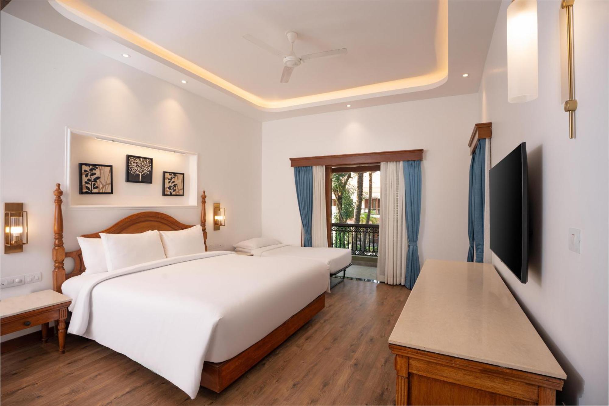 Radisson Suite Balcony Bathtub Living room & Garden view of Food & Beverages SPA 1 Goan Bottle INR 500 Hotel Credit spend of INR 5000 Early Check upto 2 hours subject