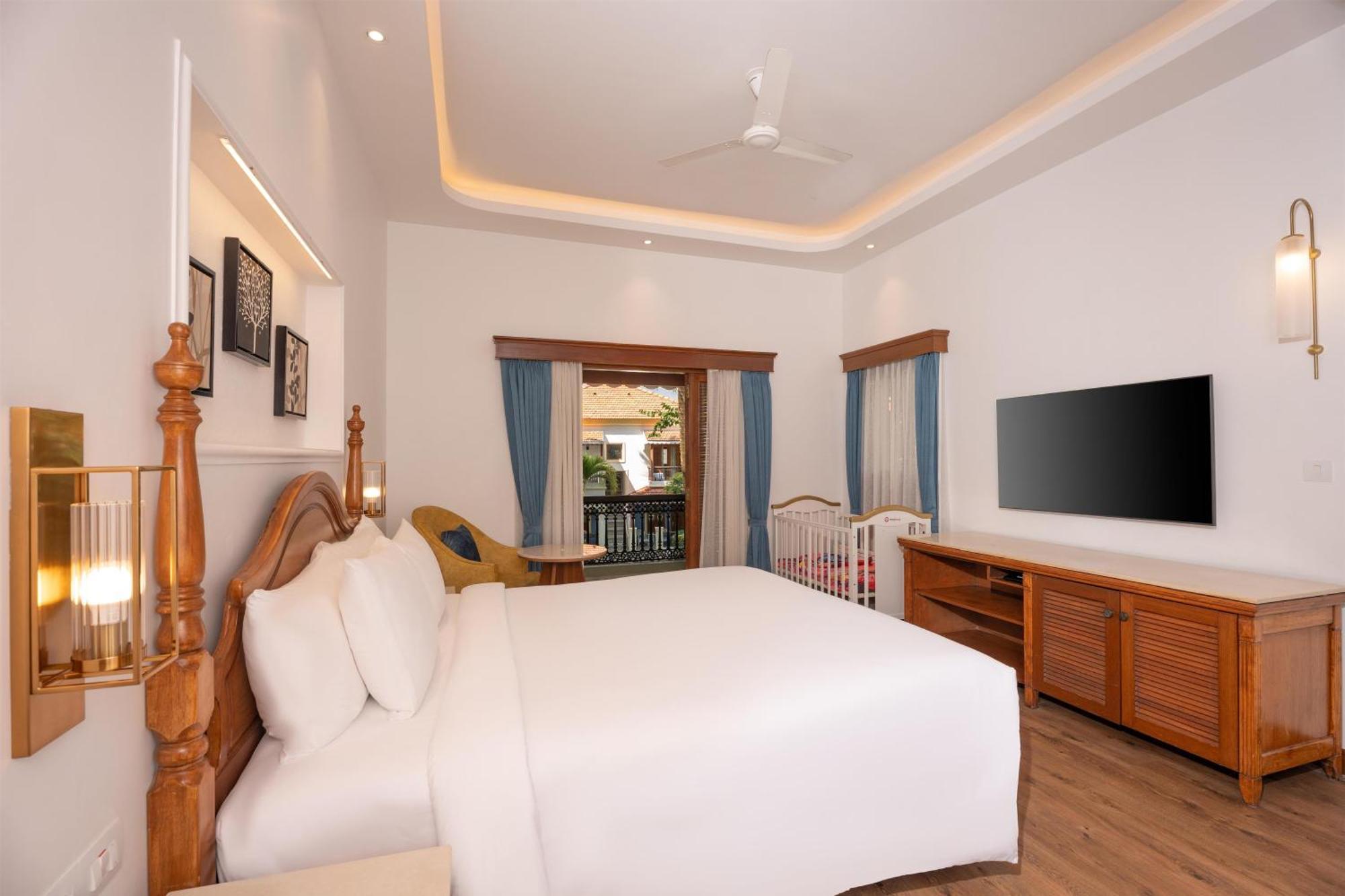 Radisson Suite Balcony Bathtub Living room & Garden view of Food & Beverages SPA 1 Goan Bottle INR 500 Hotel Credit spend of INR 5000 Early Check upto 2 hours subject